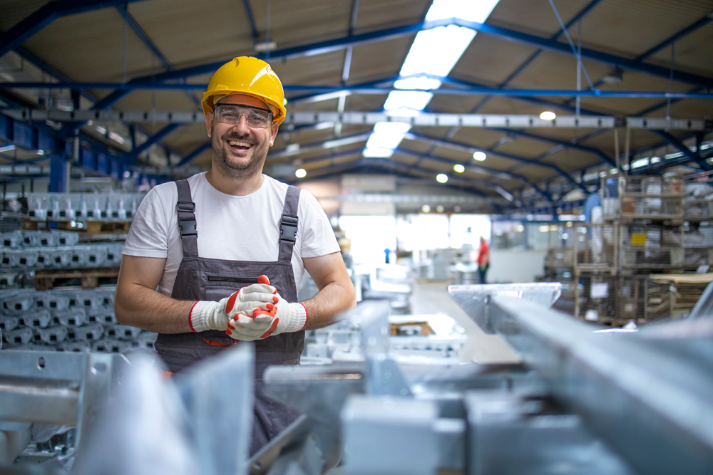 Portrait factory worker protective equipment production hall